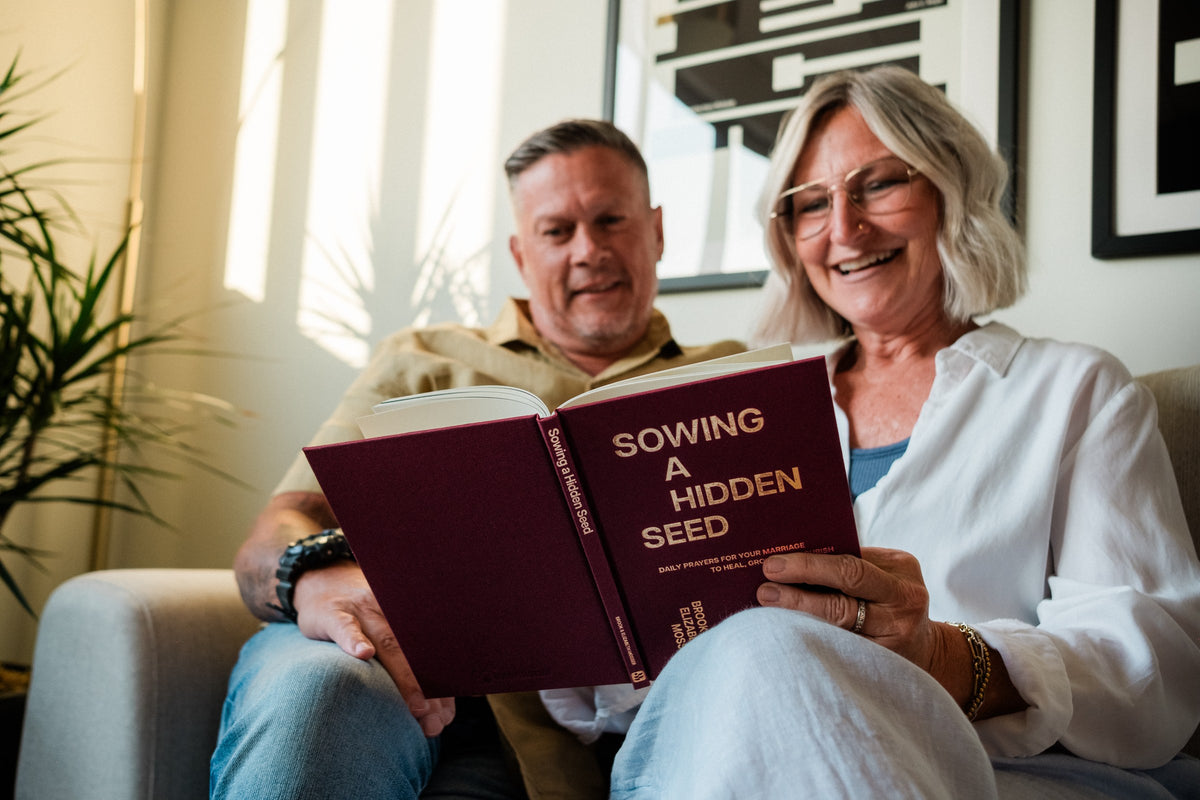 A couple reading the Sowing a Hidden Seed marriage devotional together